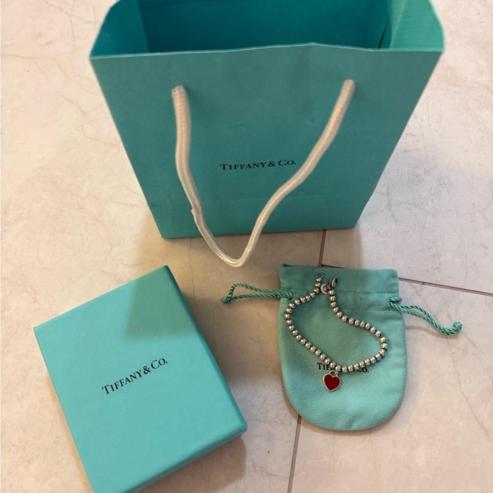 Tiffany & Co. Silver Bracelet with Red Heart Charm